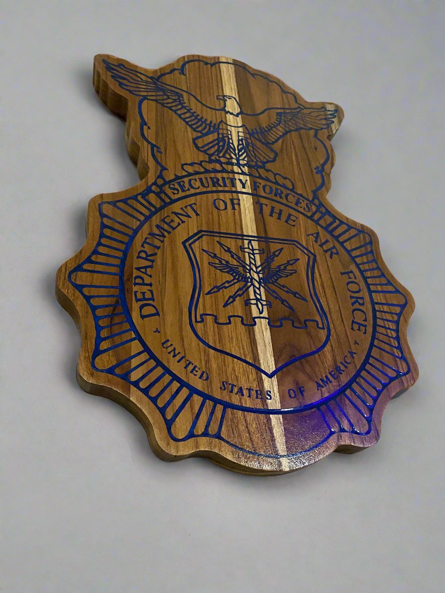 Plaque on a white background with shadows taken at an angle to show the contrasting epoxy and wood grain.