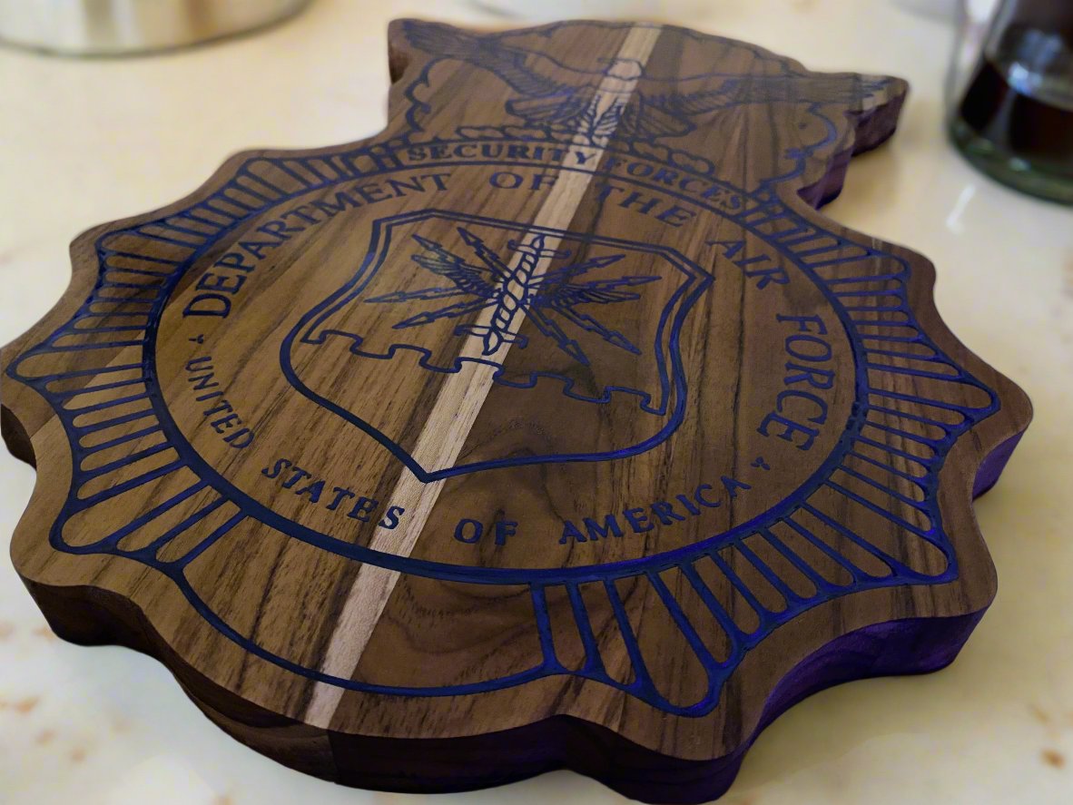 Security forces plaque set on a marble counter top in a kitchen.